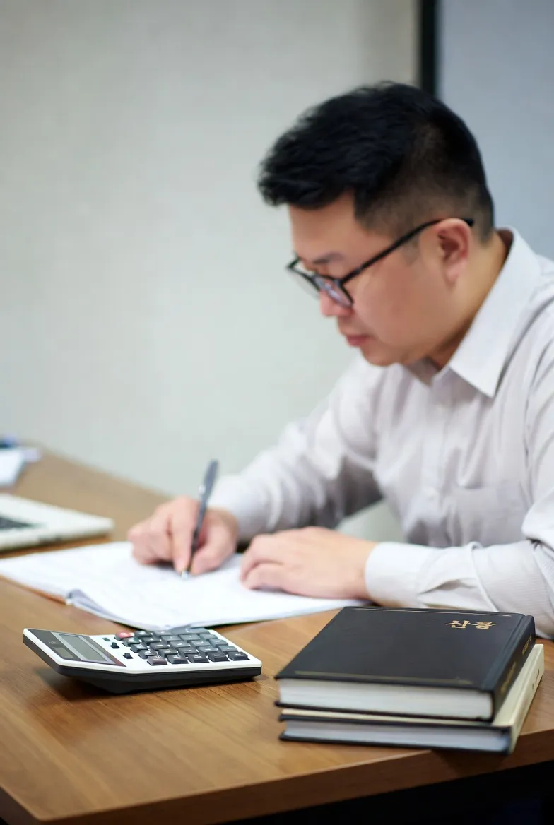 Study desk with calculator and law books for the exam